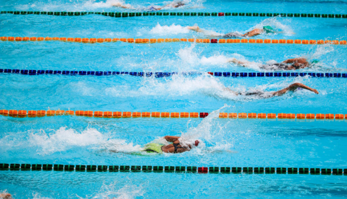 Swim Club Volunteers Doing Laps