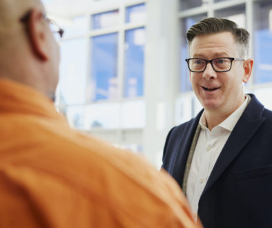 Employees Discuss Sports Facility Sales