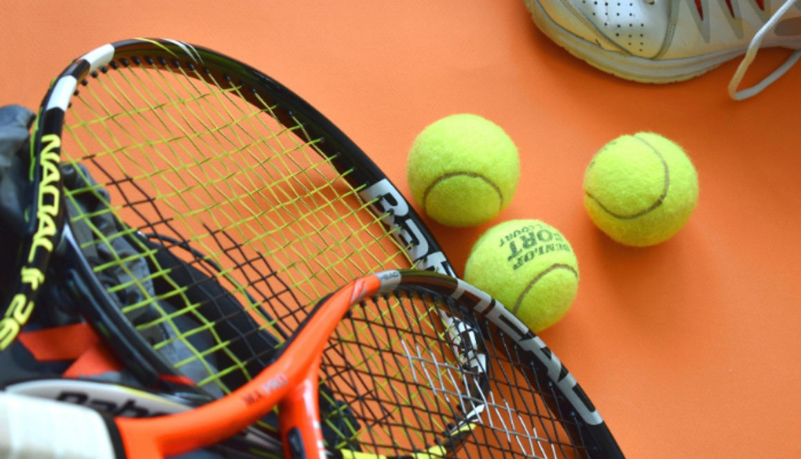 Sports Equipment with tennis racket and balls