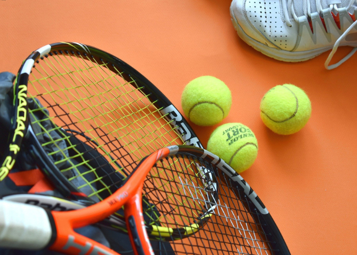 Sports Equipment with tennis racket and balls