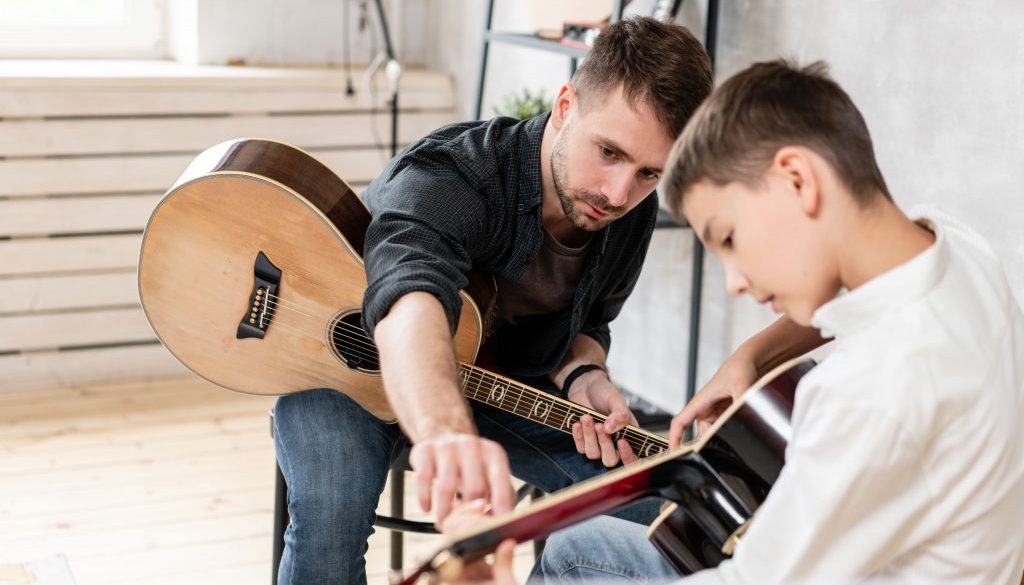 AdobeStock_282120848 Manage Lessons (Like This Guitar Lesson) With Music Lesson Scheduling Software