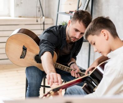 AdobeStock_282120848 Manage Lessons (Like This Guitar Lesson) With Music Lesson Scheduling Software
