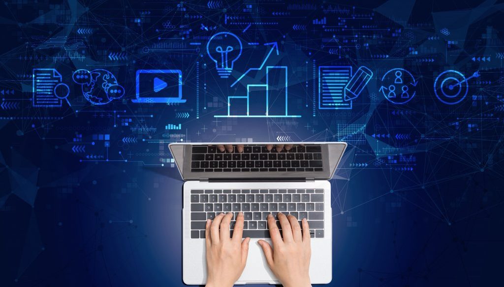 Hands typing on a laptop with a digital marketing virtual assistant concept overlay, featuring icons of analytics, content creation, and online engagement.