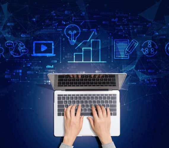 Hands typing on a laptop with a digital marketing virtual assistant concept overlay, featuring icons of analytics, content creation, and online engagement.