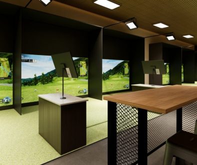 Modern indoor golf simulator setup managed with Access Golf Management, featuring a hitting station, projection screen, and seating area behind a table.