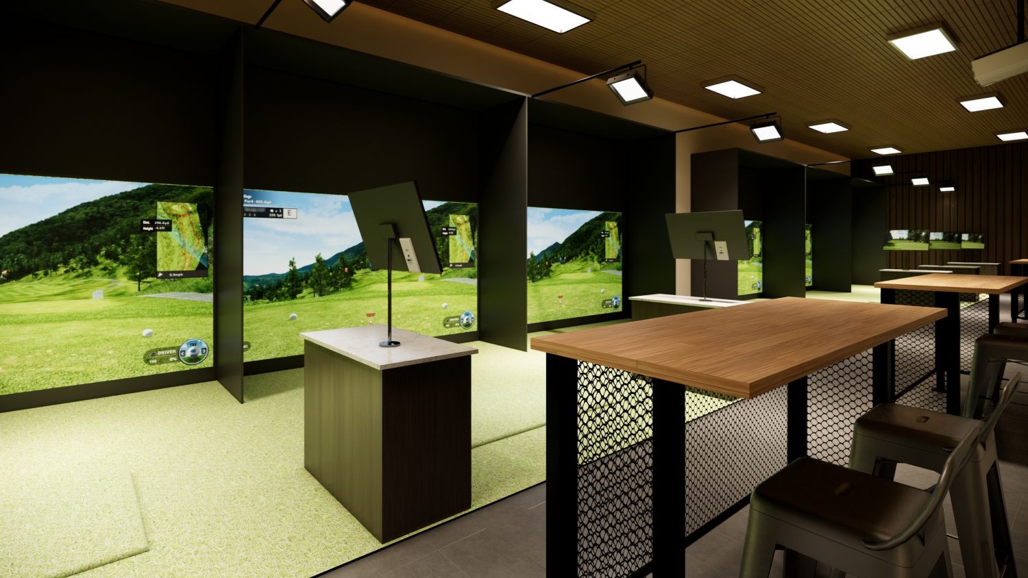 table behind a modern indoor golf simulator complete with a hitting station, projection screen, and seating area Modern indoor golf simulator setup managed with Access Golf Management, featuring a hitting station, projection screen, and seating area behind a table.
