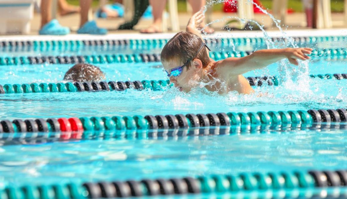 Boy swimming Butterfly in a race