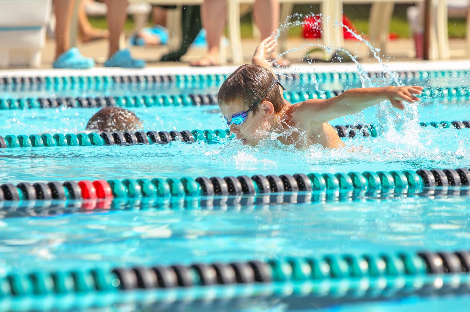 Boy swimming Butterfly in a race