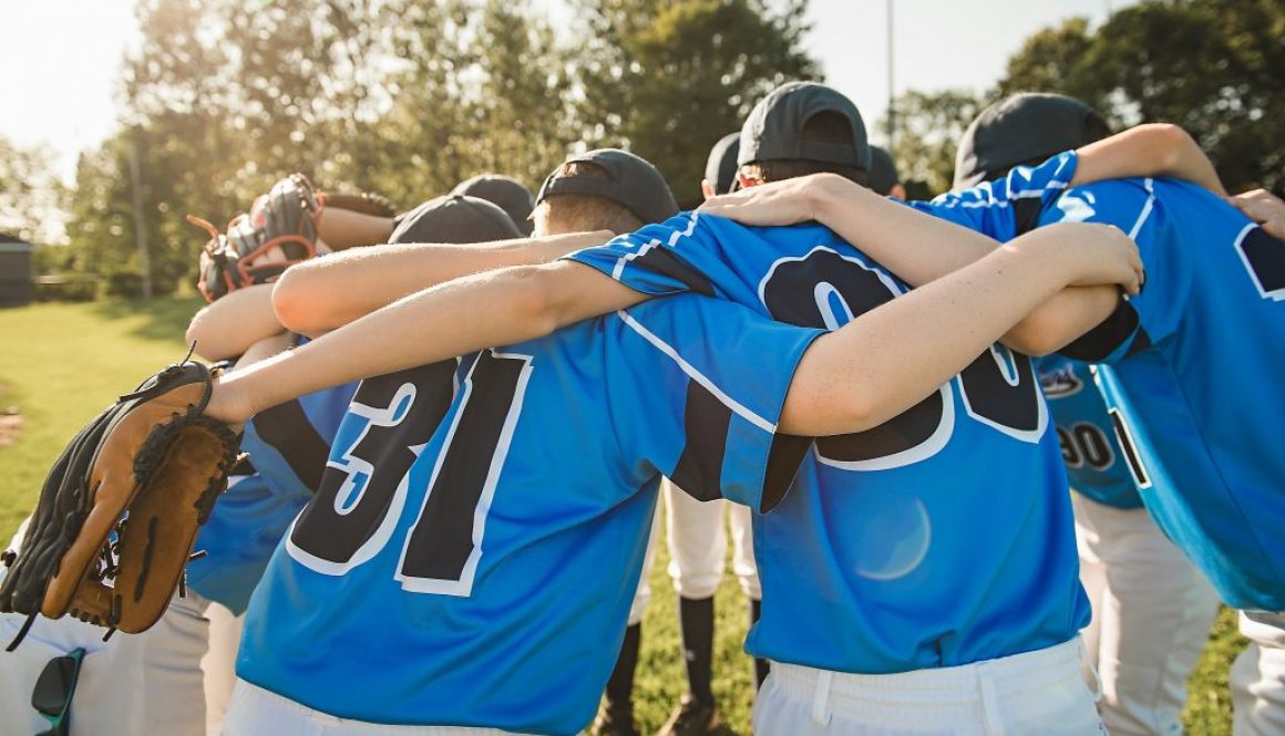 Group of baseball players standing together on the playground