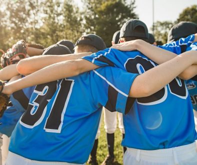 Group of baseball players standing together on the playground